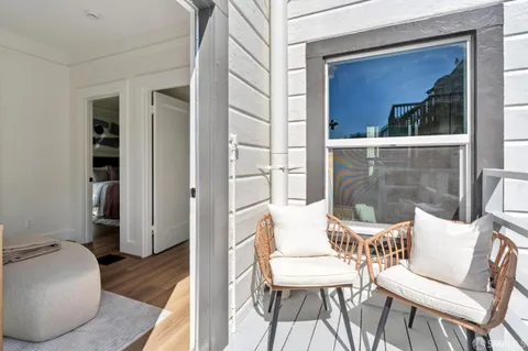 a view of a outdoor sitting area with furniture