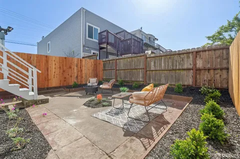 a view of a storage and utility room with two washing machine