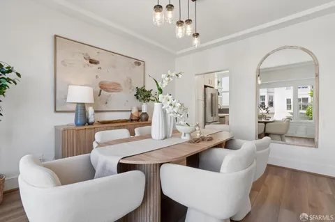 a kitchen with stainless steel appliances wooden floor sink and wooden cabinets