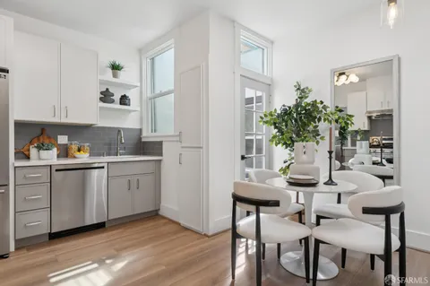 a kitchen with a sink and cabinets