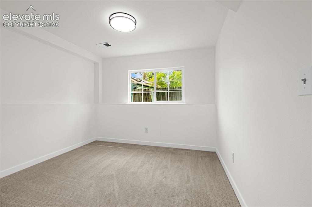 17396 East Rice Circle, Unit D Aurora, CO 80015 - Photo 28 of 48 Basement Bedroom
