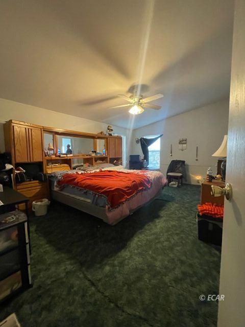 953 Spring Valley Parkway Spring Creek, NV 89815 - Photo 10 of 17 a bedroom with bed and window