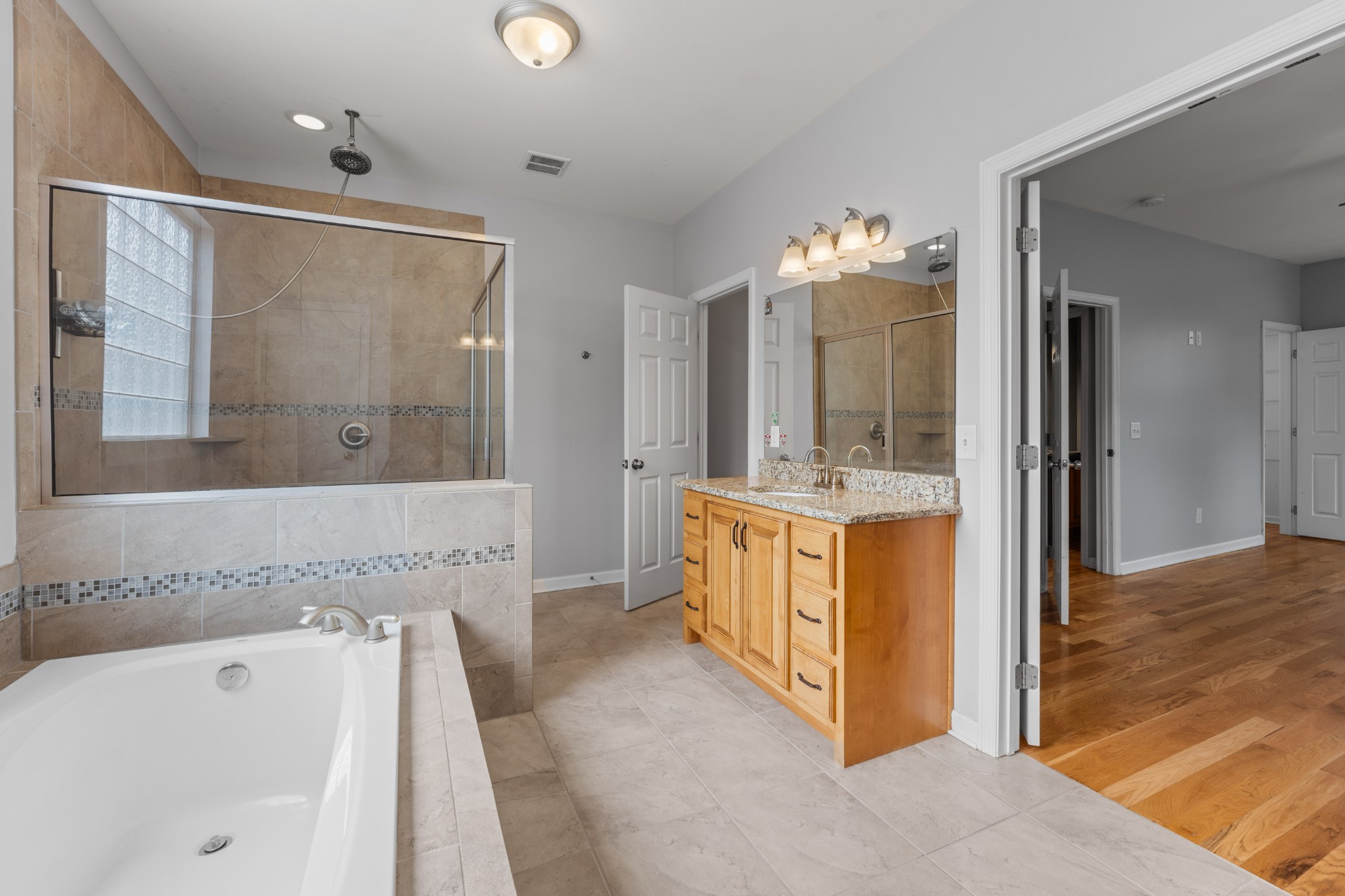 114 Cartwright Parkway Goodlettsville, TN 37072 - Photo 13 of 34 a spacious bathroom with a tub shower and sink