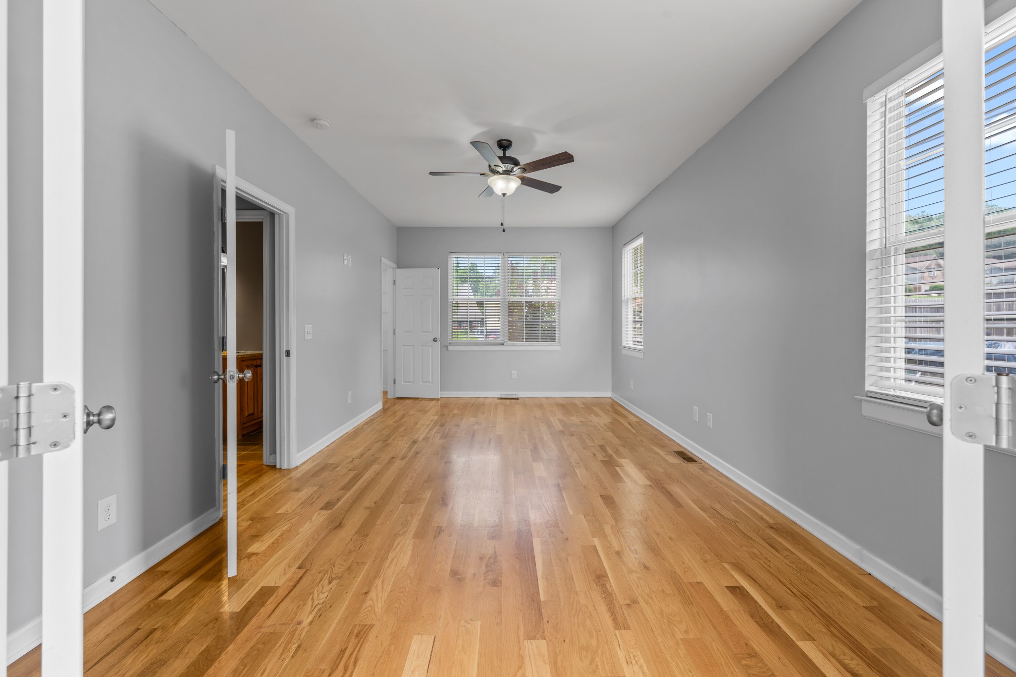 114 Cartwright Parkway Goodlettsville, TN 37072 - Photo 16 of 34 wooden floor in an empty room with a window