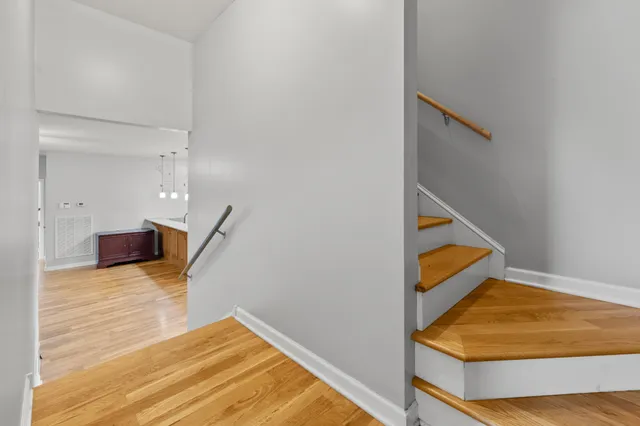 a view of kitchen and hall with wooden floor