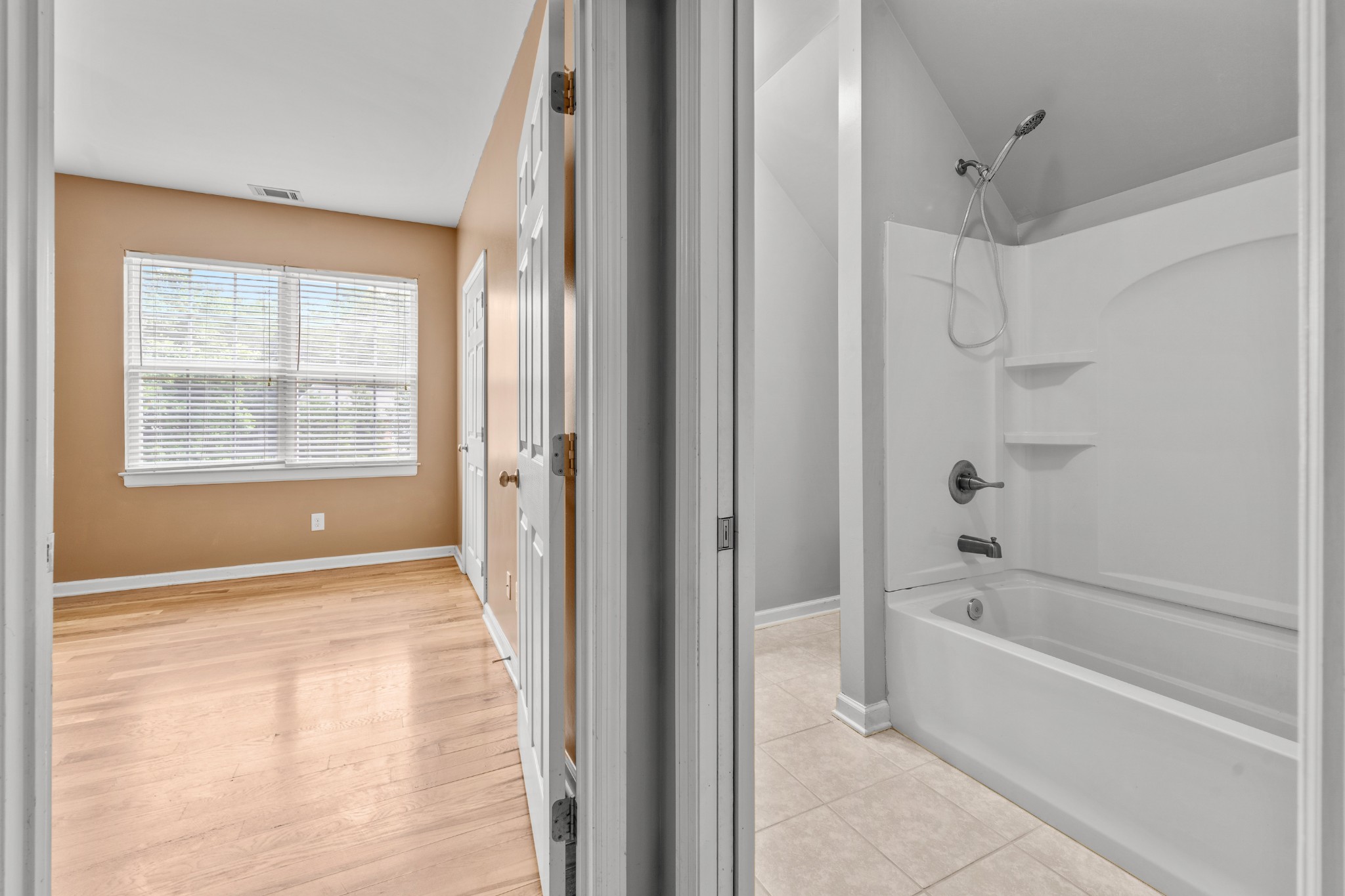 114 Cartwright Parkway Goodlettsville, TN 37072 - Photo 25 of 34 a bathroom with a bathtub and a shower