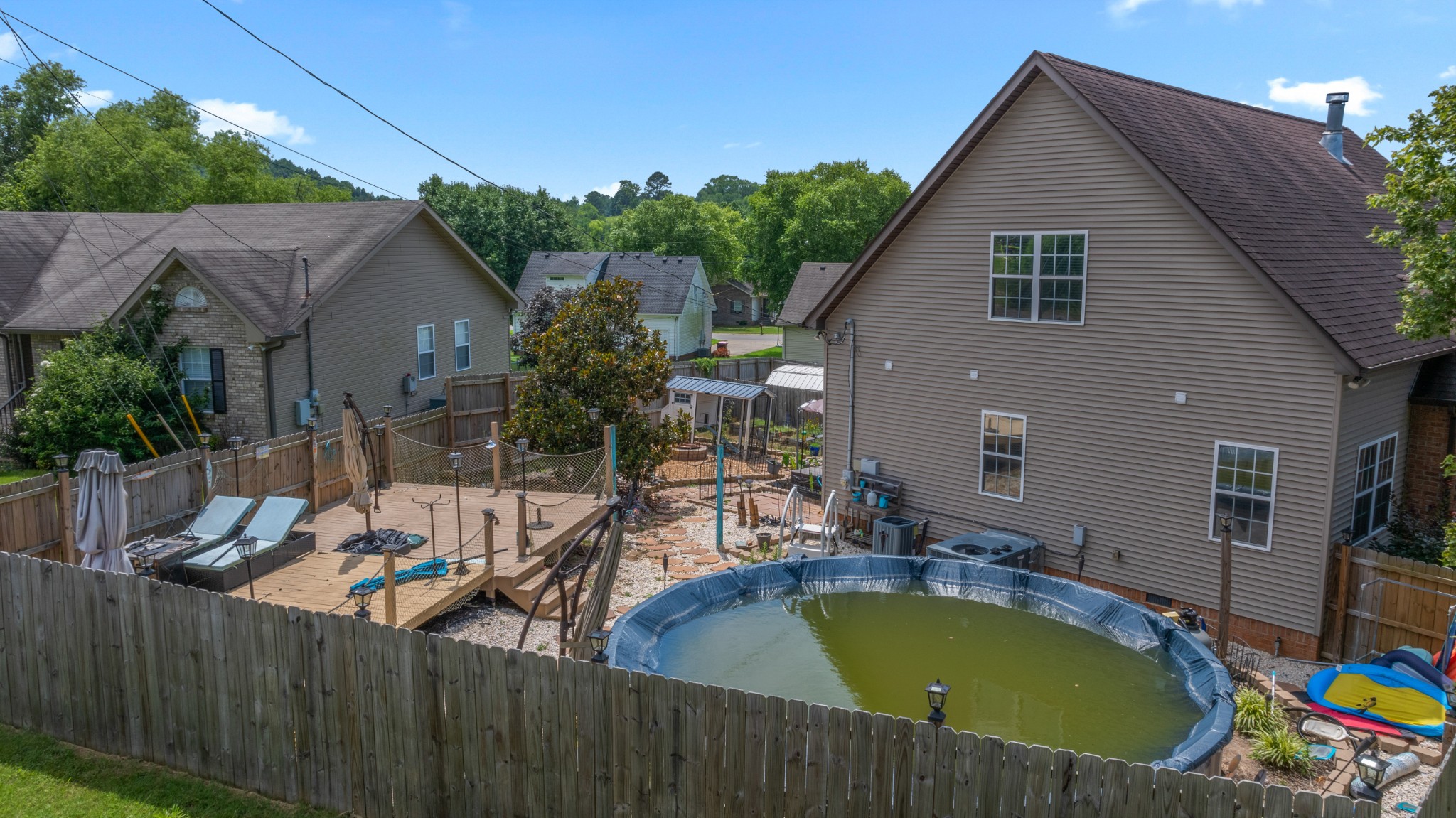 114 Cartwright Parkway Goodlettsville, TN 37072 - Photo 31 of 34 a view of a house with pool and chairs