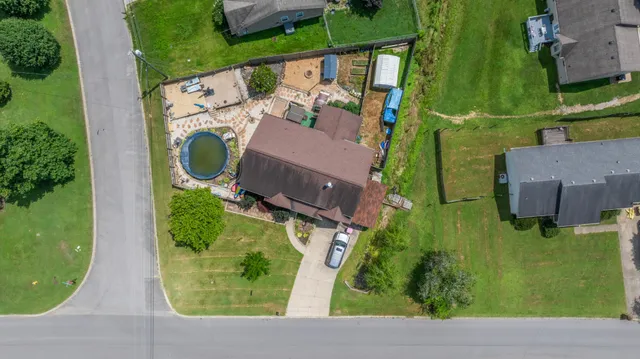 an aerial view of house with yard