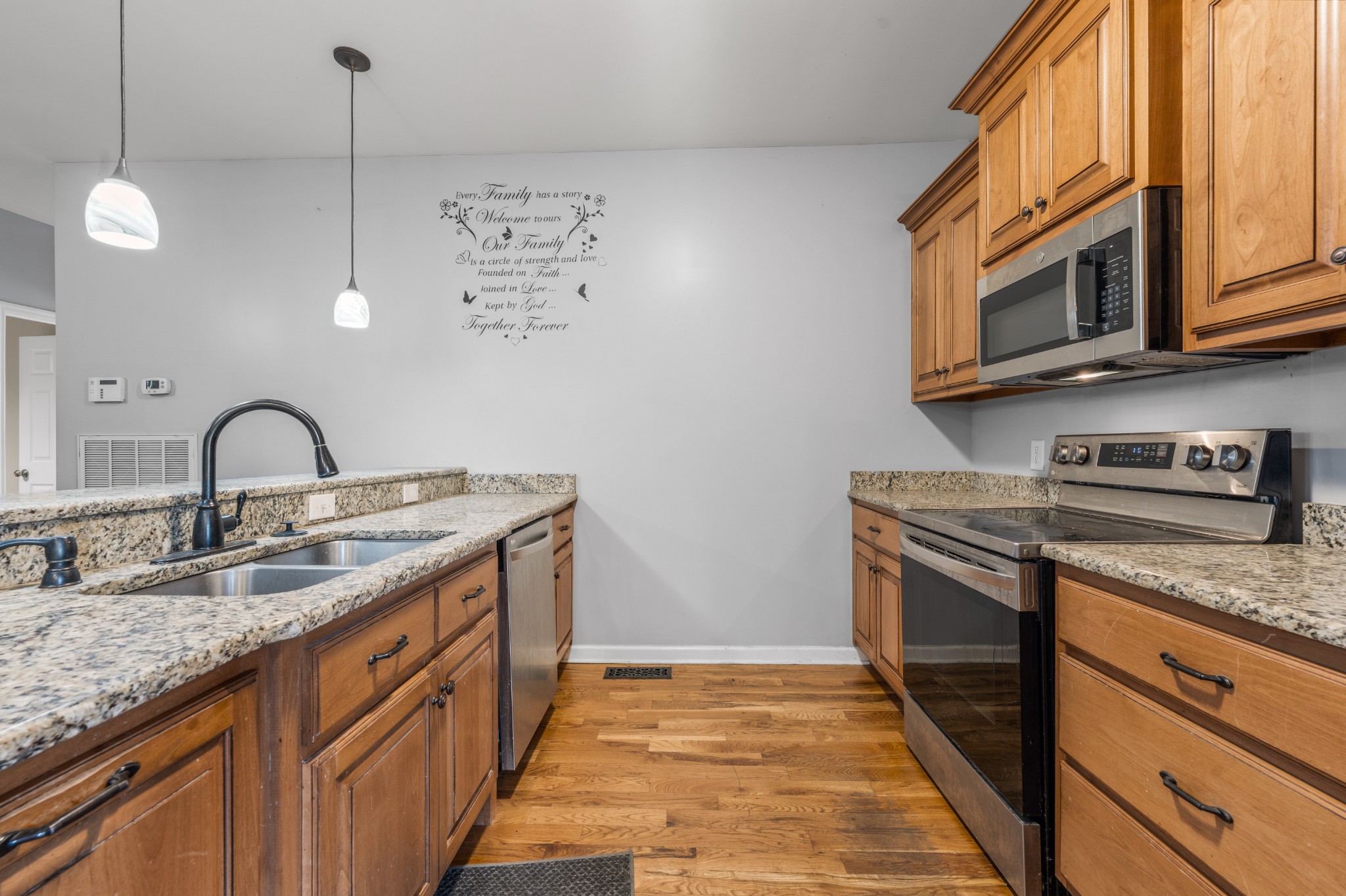 114 Cartwright Parkway Goodlettsville, TN 37072 - Photo 6 of 34 a kitchen with stainless steel appliances granite countertop a sink and a stove