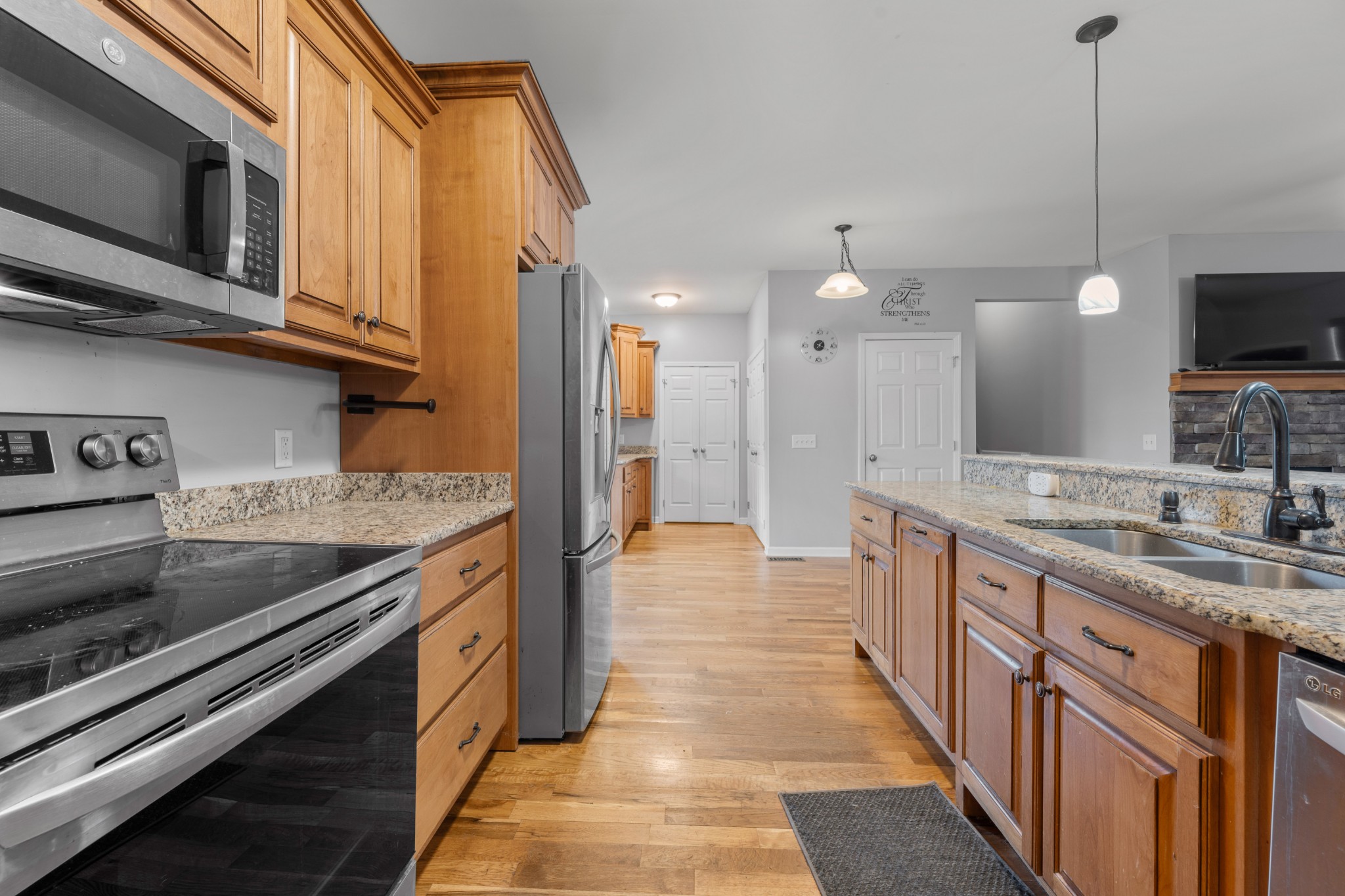 114 Cartwright Parkway Goodlettsville, TN 37072 - Photo 7 of 34 a kitchen with stainless steel appliances granite countertop a stove a sink and a microwave