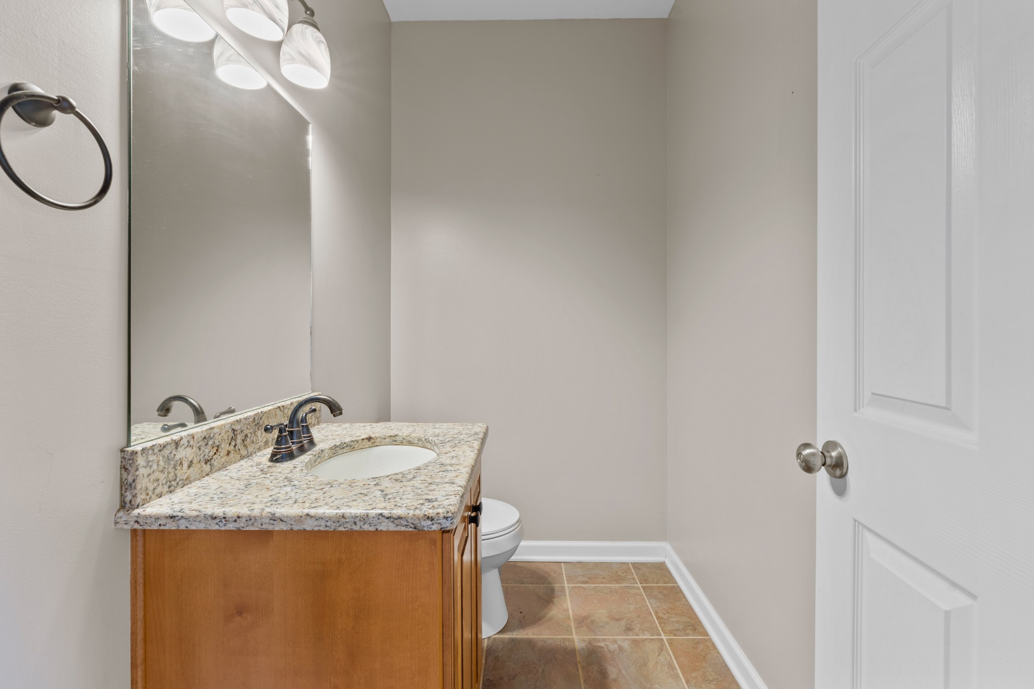 114 Cartwright Parkway Goodlettsville, TN 37072 - Photo 10 of 34 a bathroom with a granite countertop sink toilet and a mirror