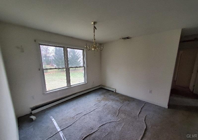 5535 Cetronia Road Allentown, PA 18104 - Photo 4 of 15 an empty room with a fireplace and windows