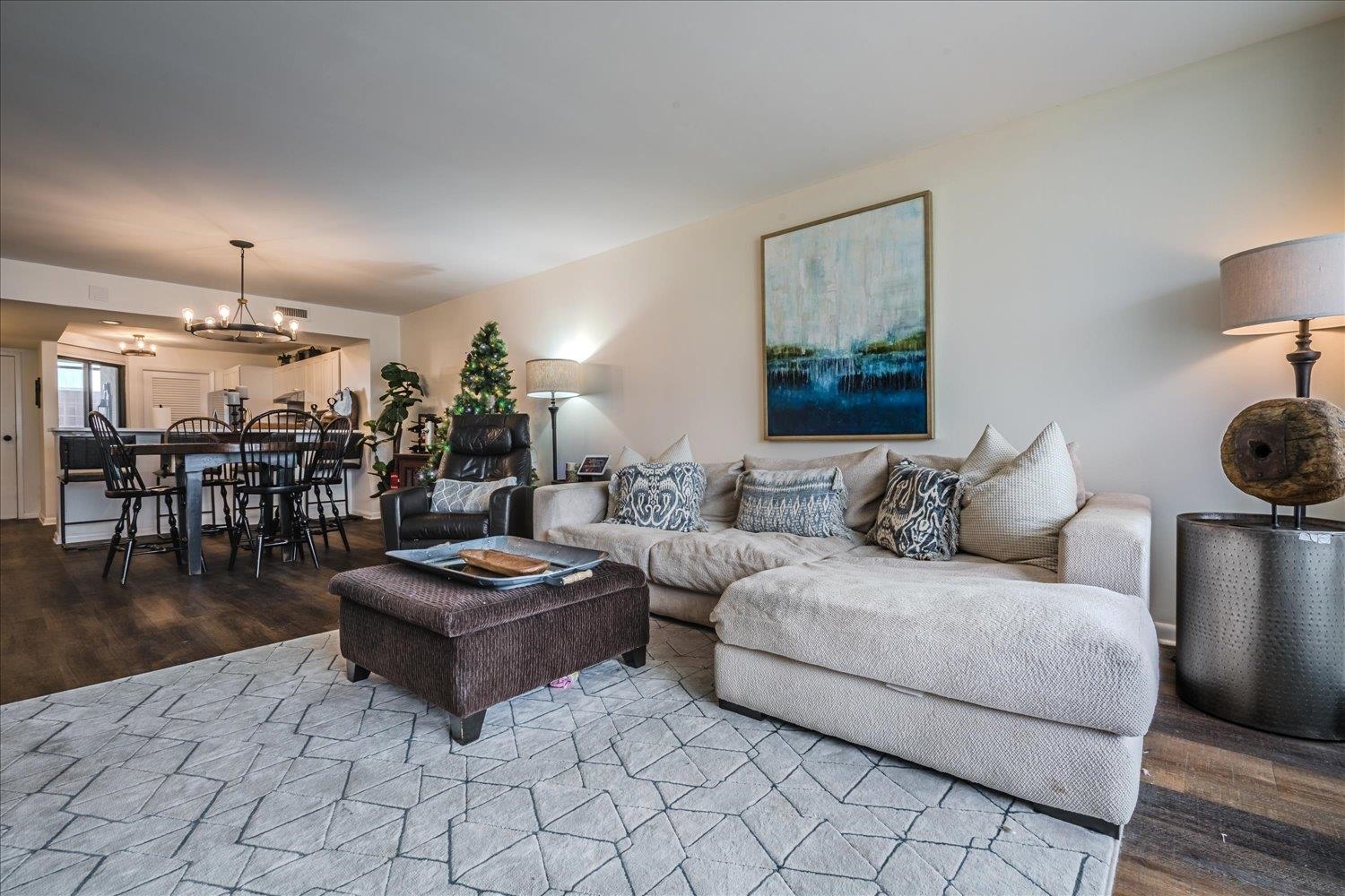 200 Wagner Place, Unit 706 Memphis, TN 38103 - Photo 12 of 32 a living room with furniture and wooden floor