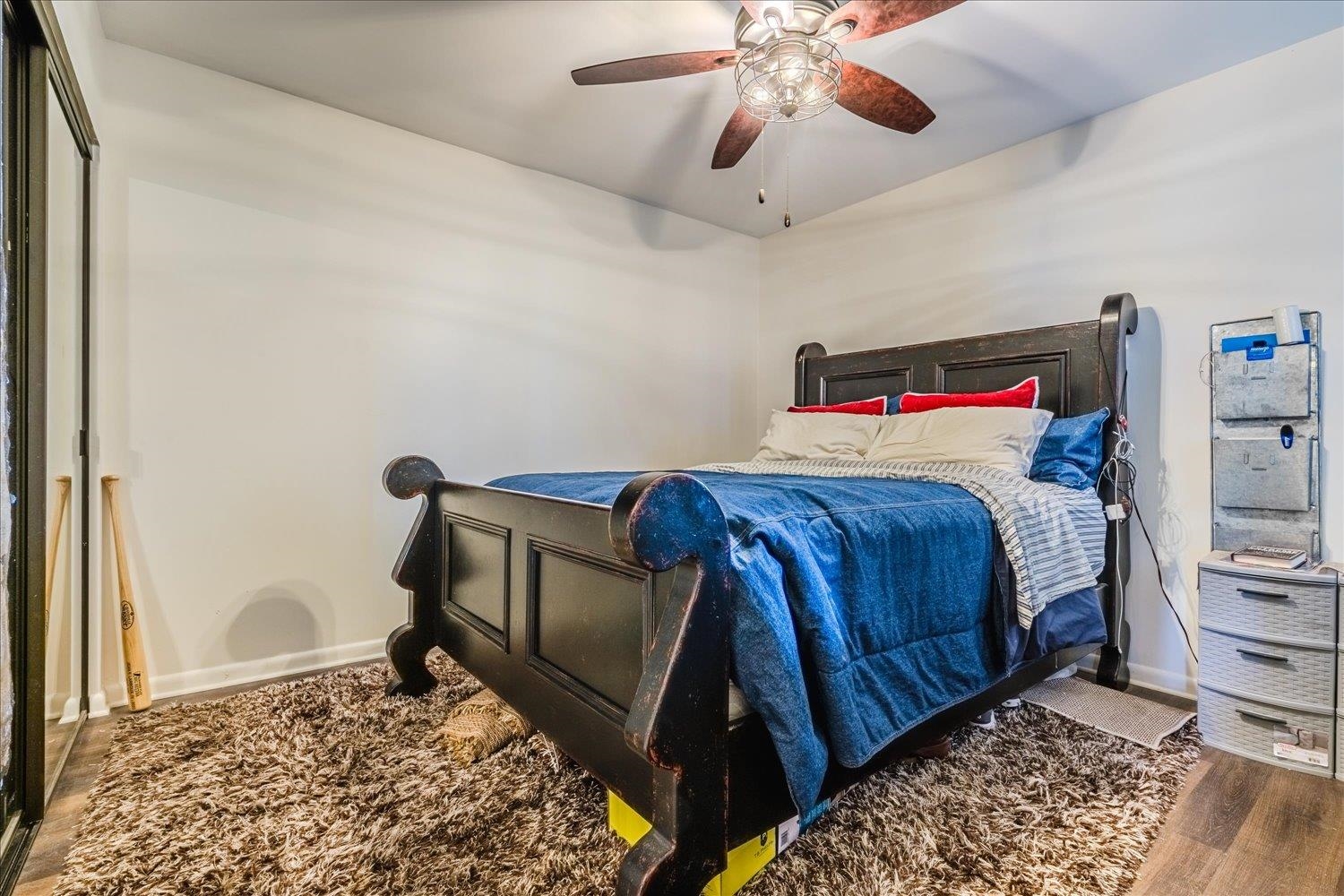200 Wagner Place, Unit 706 Memphis, TN 38103 - Photo 18 of 32 a bedroom with a bed and a dresser