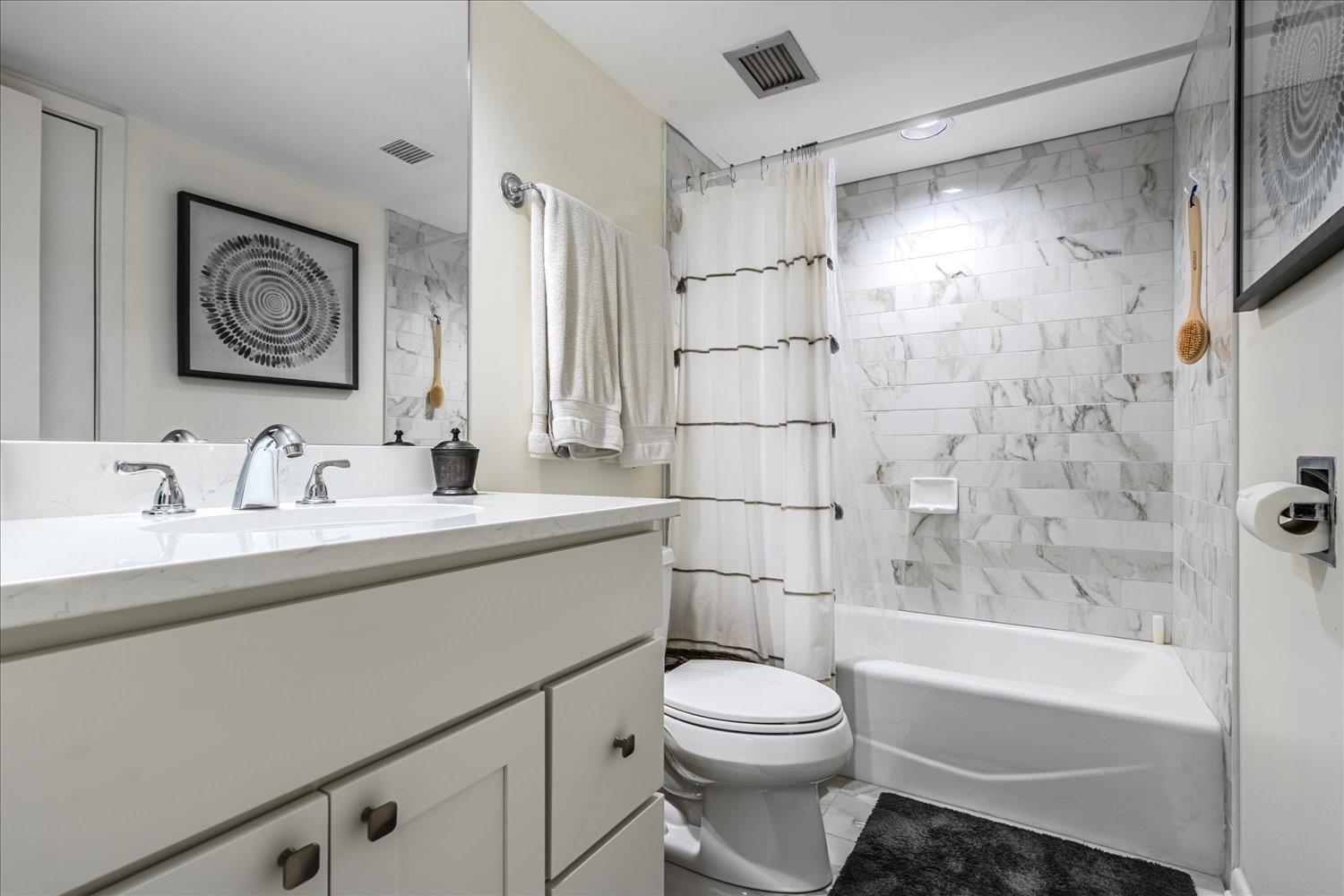 200 Wagner Place, Unit 706 Memphis, TN 38103 - Photo 19 of 32 a bathroom with a sink a toilet and shower
