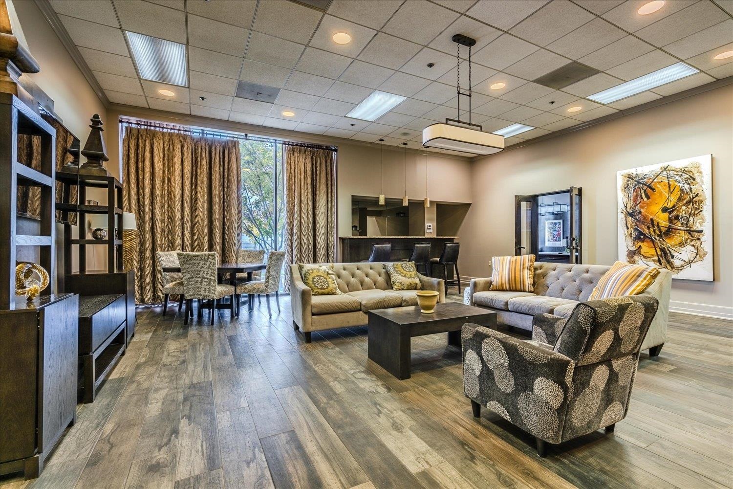 200 Wagner Place, Unit 706 Memphis, TN 38103 - Photo 21 of 32 a living room with furniture and a chandelier