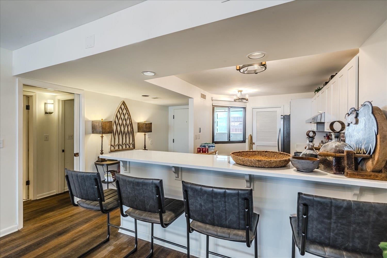 200 Wagner Place, Unit 706 Memphis, TN 38103 - Photo 8 of 32 a view of a dining room with furniture and wooden floor