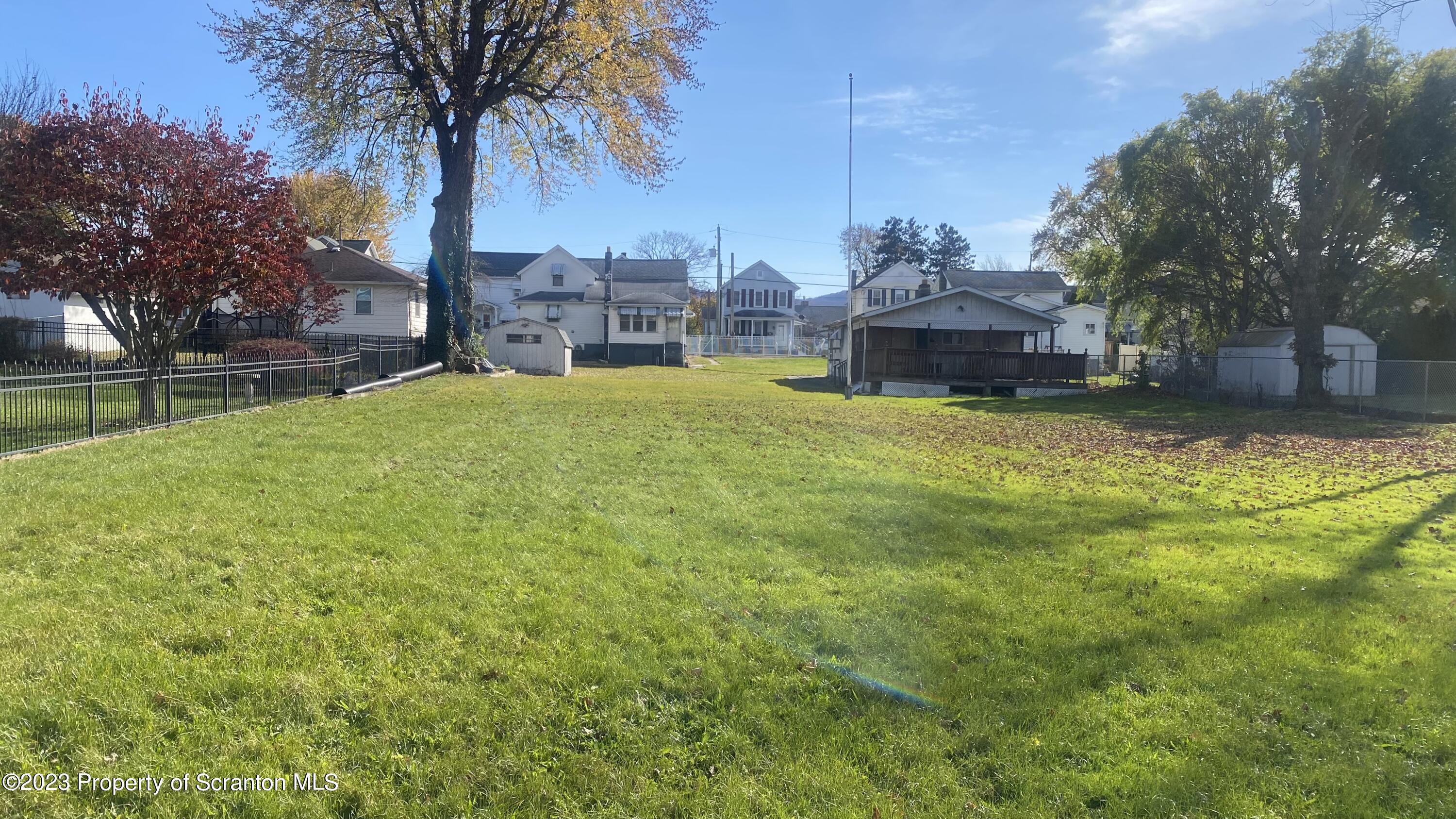 Oak Avenue Scranton, PA 18505 - Photo 6 of 7 a view of a house with a yard and a table and chairs