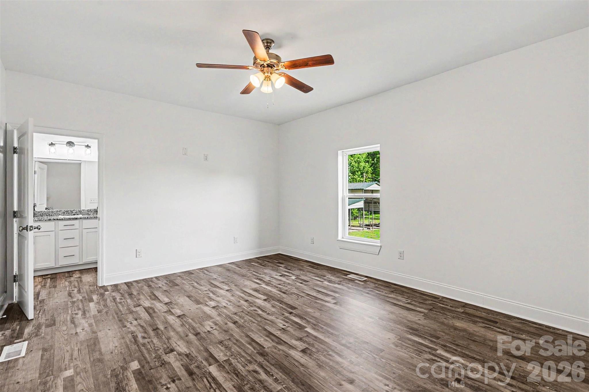 405 Aquadale Road Albemarle, NC 28001 - Photo 17 of 29 wooden floor in an empty room with a window