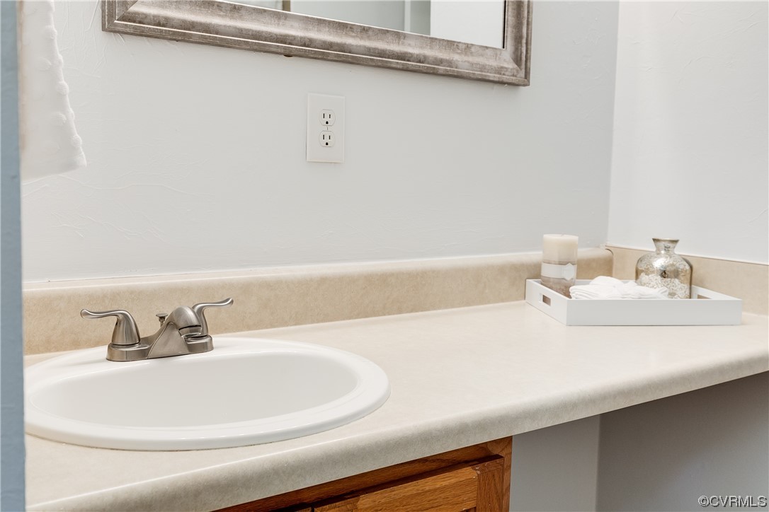 2655 Ridge Road Powhatan, VA 23139 - Photo 13 of 25 a bathroom with a sink and a mirror