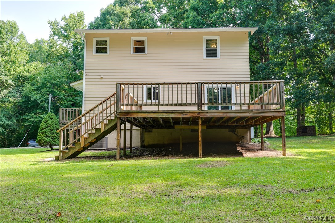 2655 Ridge Road Powhatan, VA 23139 - Photo 21 of 25 a view of a house with a backyard and deck