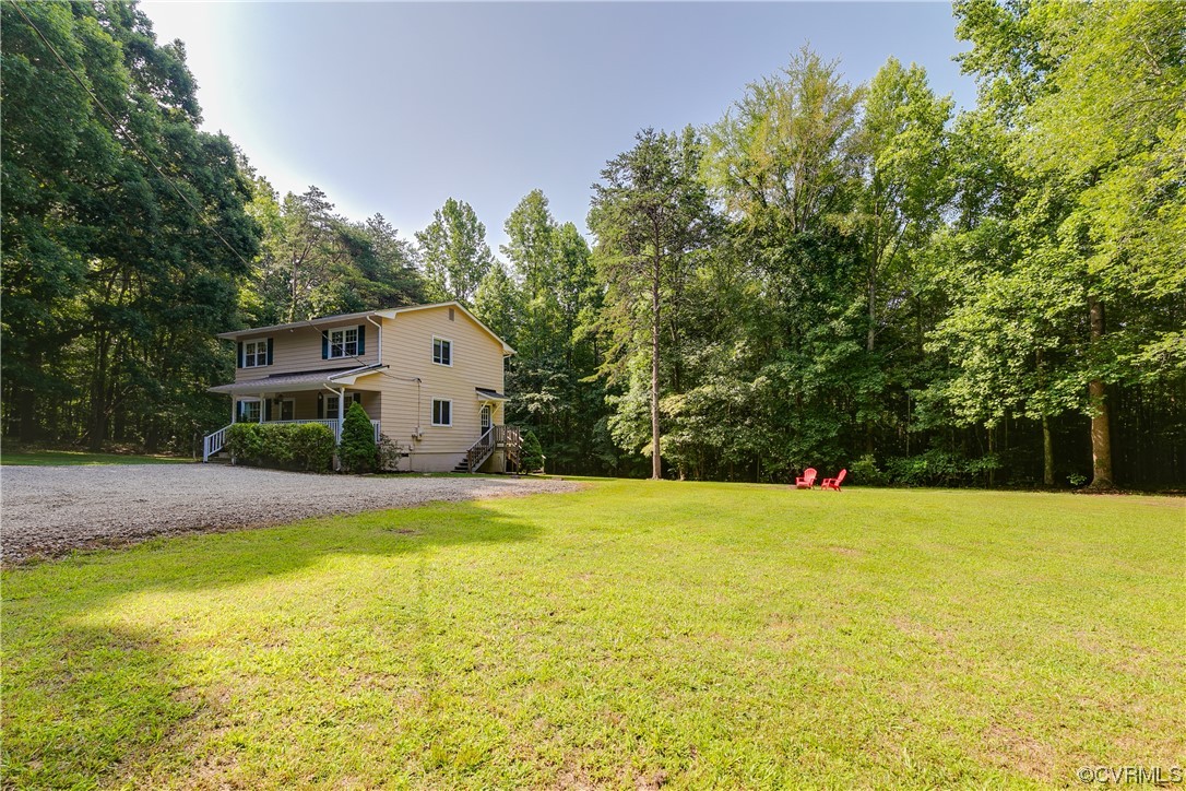 2655 Ridge Road Powhatan, VA 23139 - Photo 25 of 25 a view of a house with pool and trees in the background