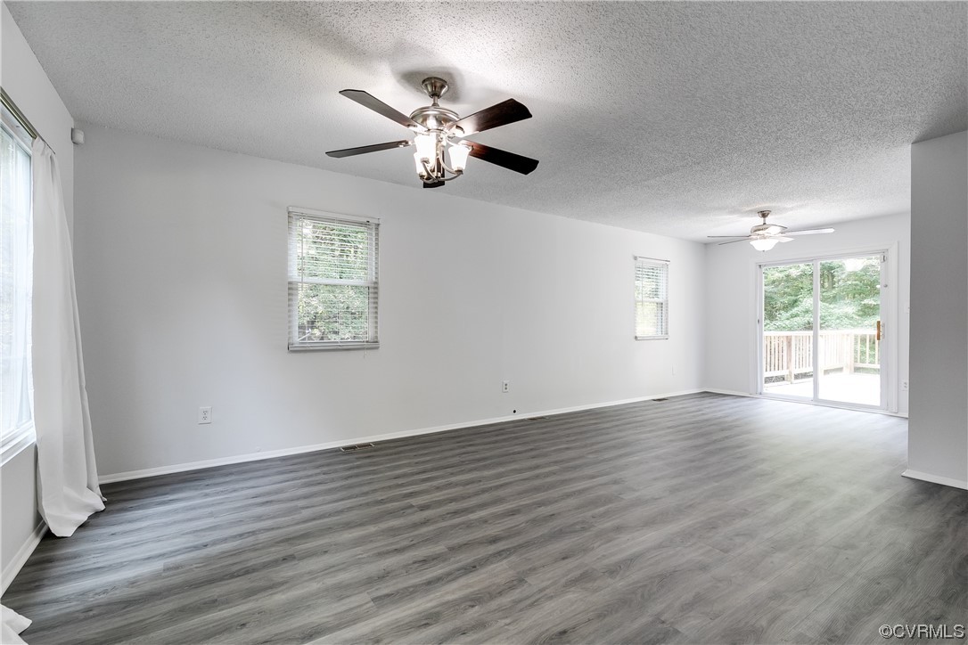 2655 Ridge Road Powhatan, VA 23139 - Photo 4 of 25 a view of an empty room with wooden floor and a window