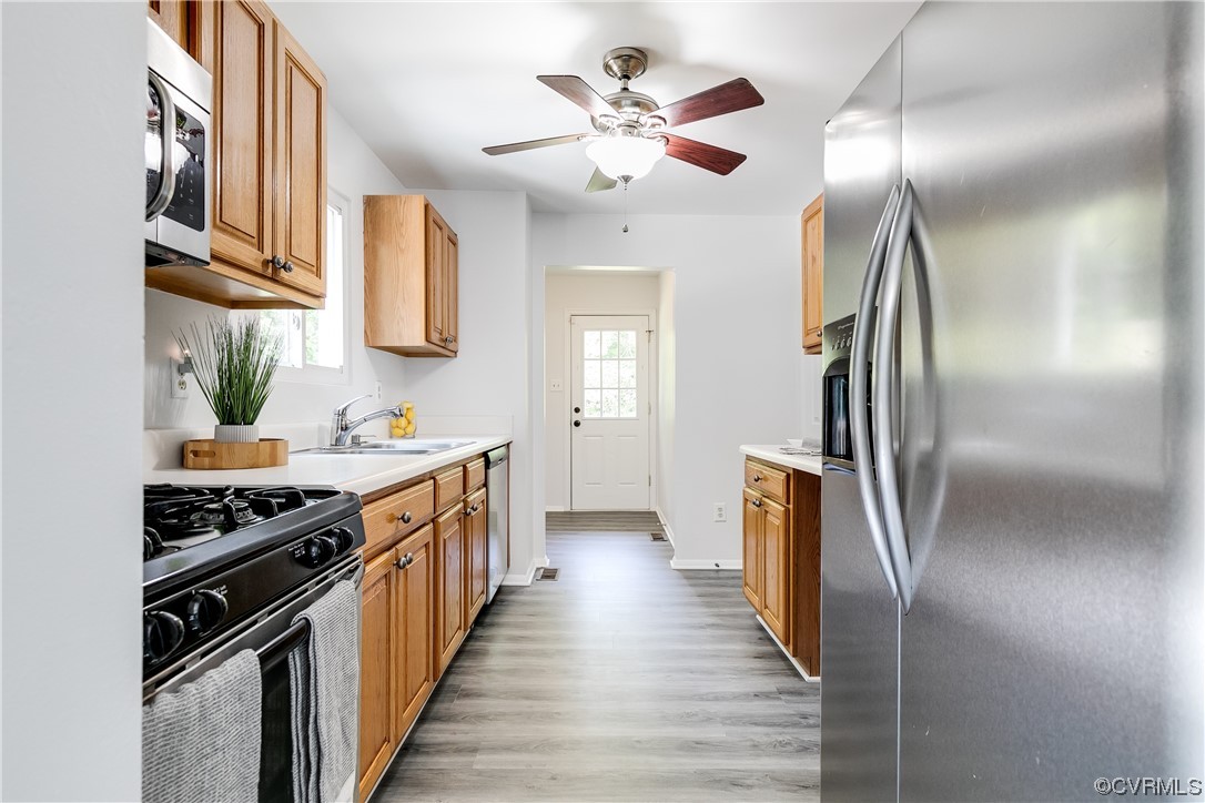 2655 Ridge Road Powhatan, VA 23139 - Photo 6 of 25 a kitchen with stainless steel appliances a sink and a stove