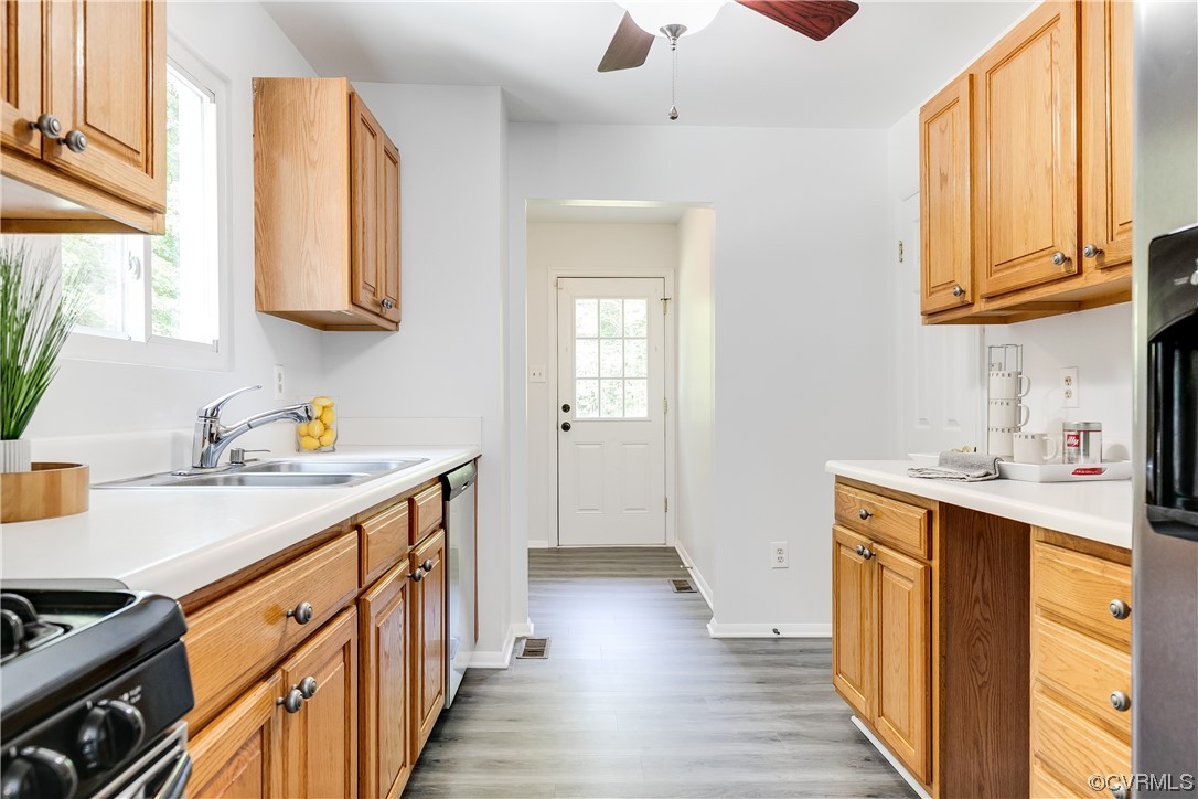 2655 Ridge Road Powhatan, VA 23139 - Photo 8 of 25 a kitchen with stainless steel appliances granite countertop a sink and dishwasher a stove with wooden floor