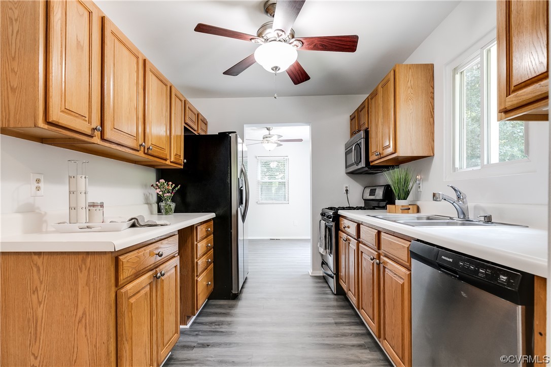 2655 Ridge Road Powhatan, VA 23139 - Photo 9 of 25 a kitchen with stainless steel appliances granite countertop a sink a stove and a refrigerator