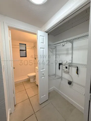 a bathroom with a glass door shower