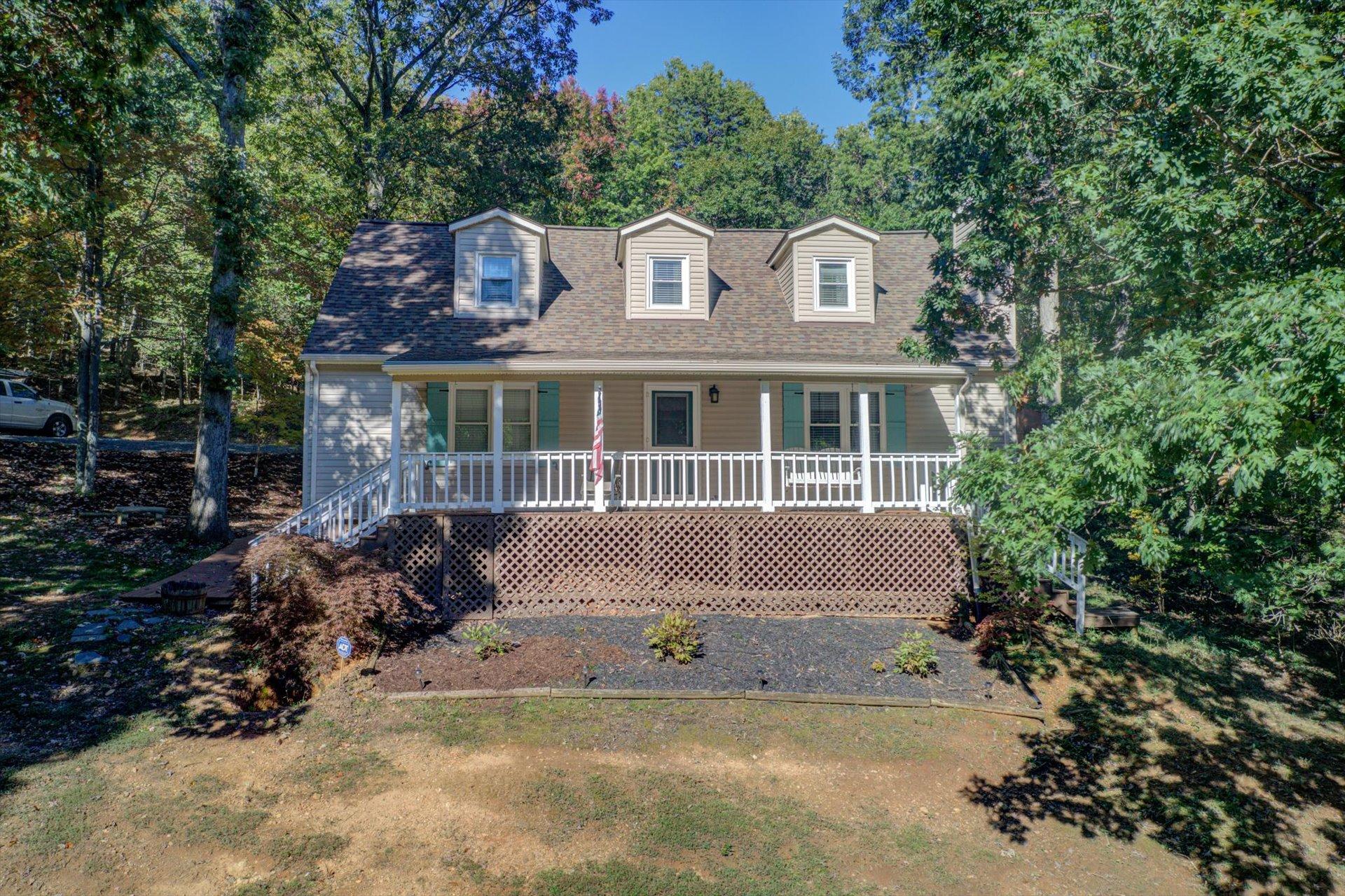 772 Skyview Road Salem, VA 24153 - Photo 2 of 41 a front view of a house with a garden and plants