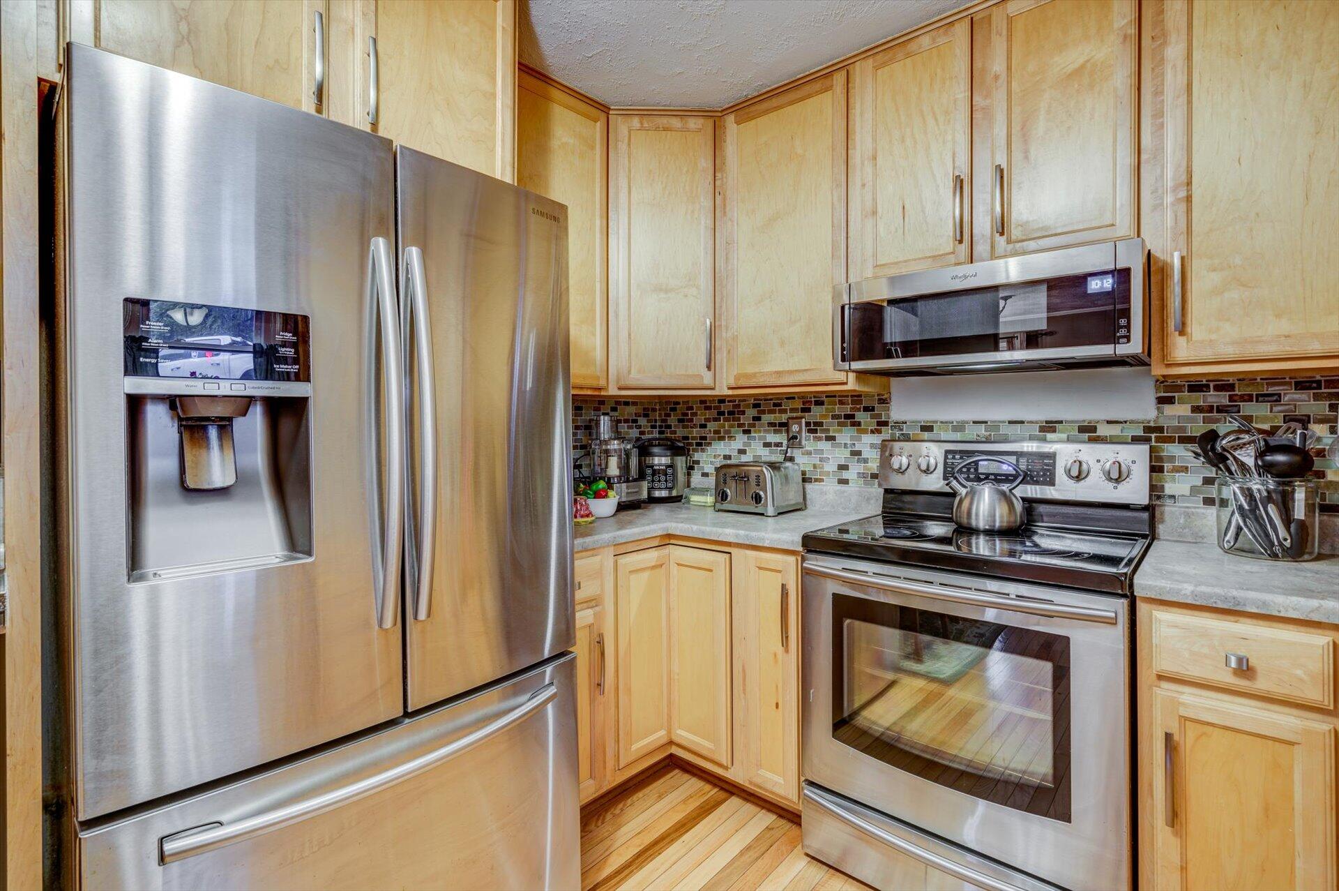 772 Skyview Road Salem, VA 24153 - Photo 14 of 41 a kitchen with stainless steel appliances granite countertop a refrigerator sink and stove