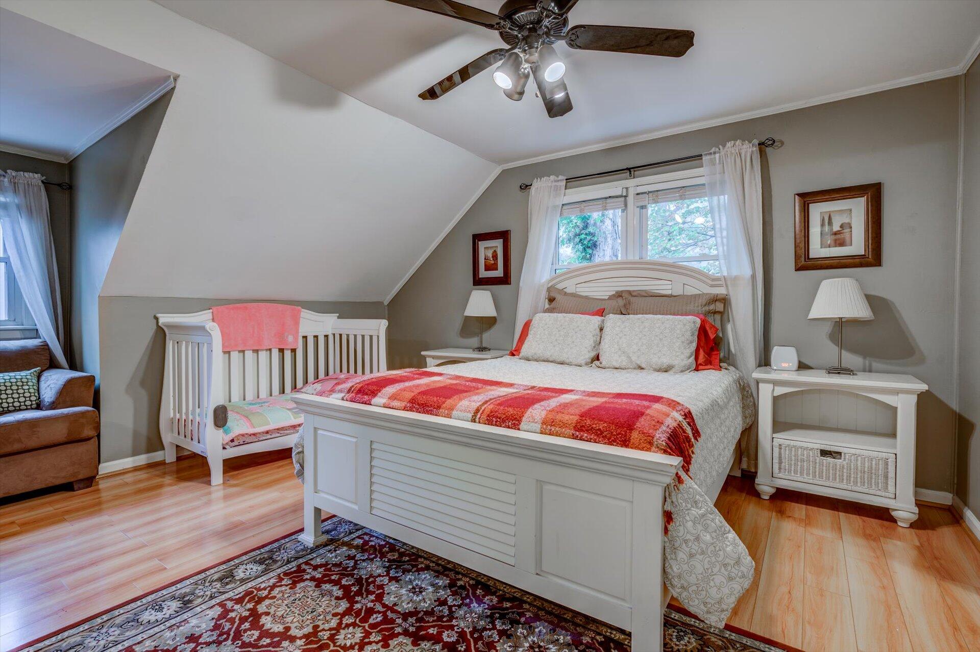 772 Skyview Road Salem, VA 24153 - Photo 20 of 41 a bedroom with a bed and a chandelier