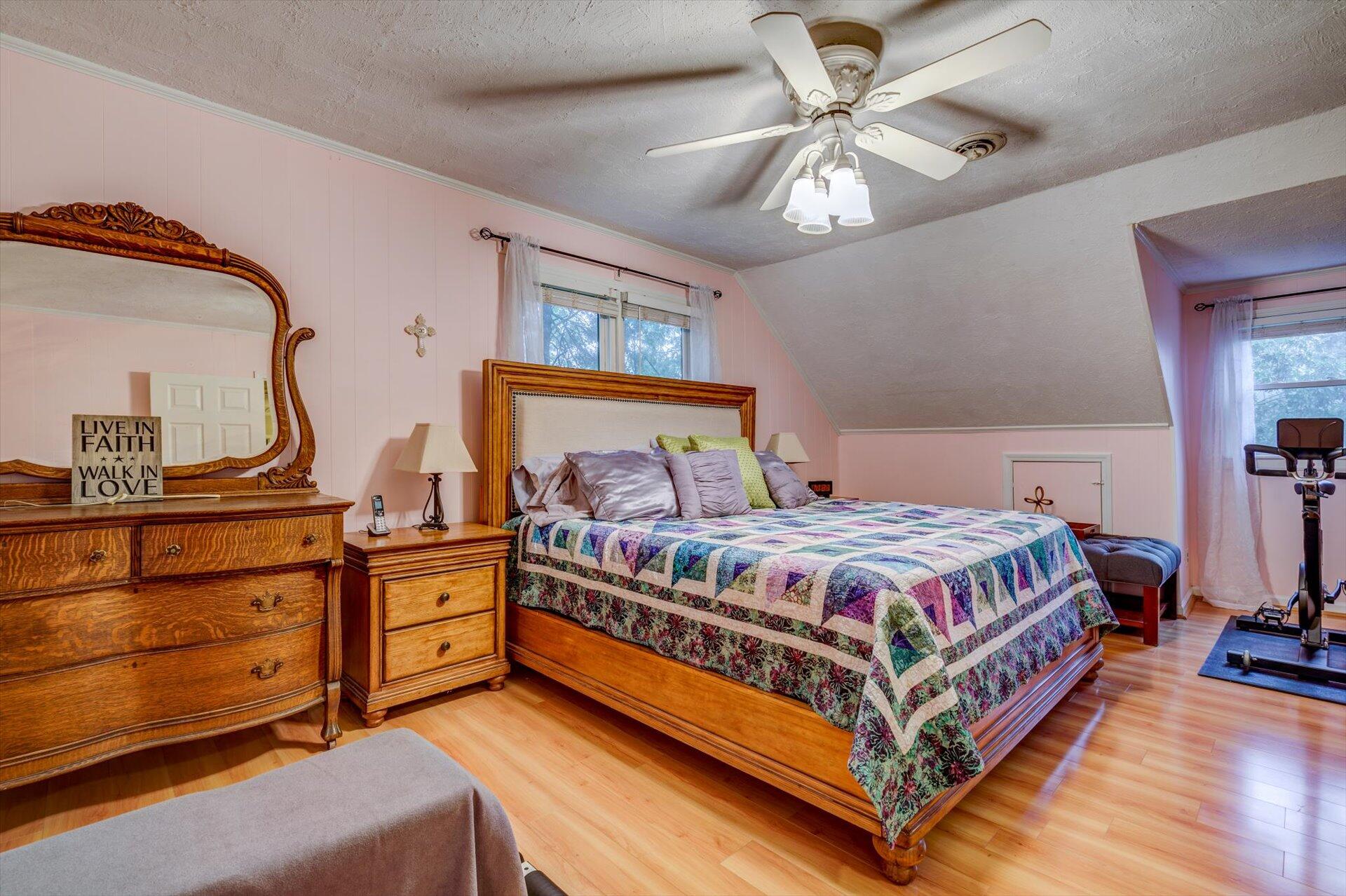 772 Skyview Road Salem, VA 24153 - Photo 25 of 41 a bedroom with a bed and a chandelier