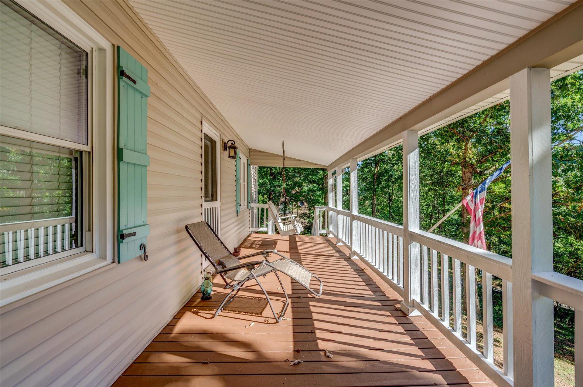 772 Skyview Road Salem, VA 24153 - Photo 4 of 41 a view of a patio with table and chairs and wooden floor