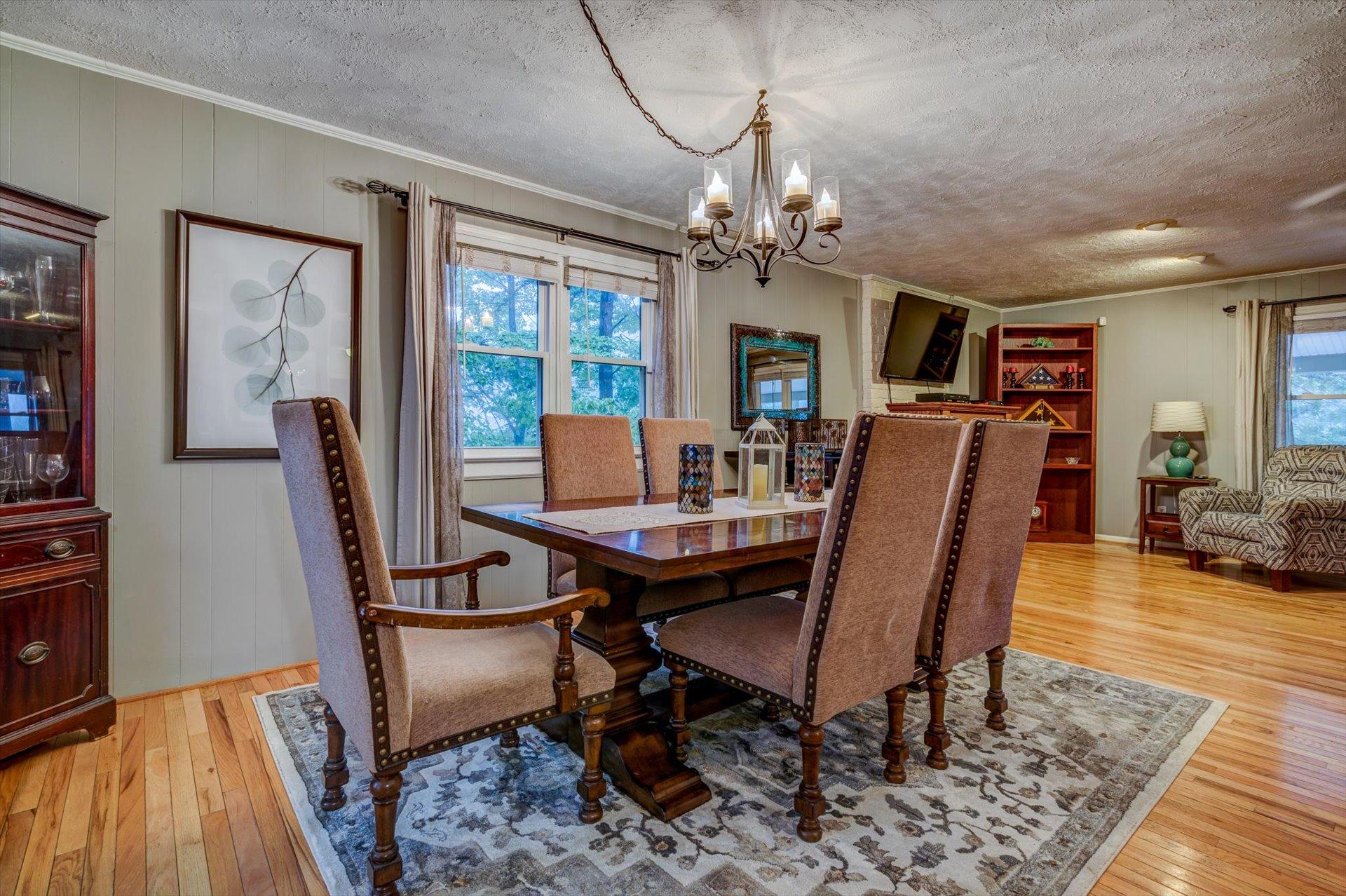 772 Skyview Road Salem, VA 24153 - Photo 10 of 41 a view of a dining room with furniture window and wooden floor