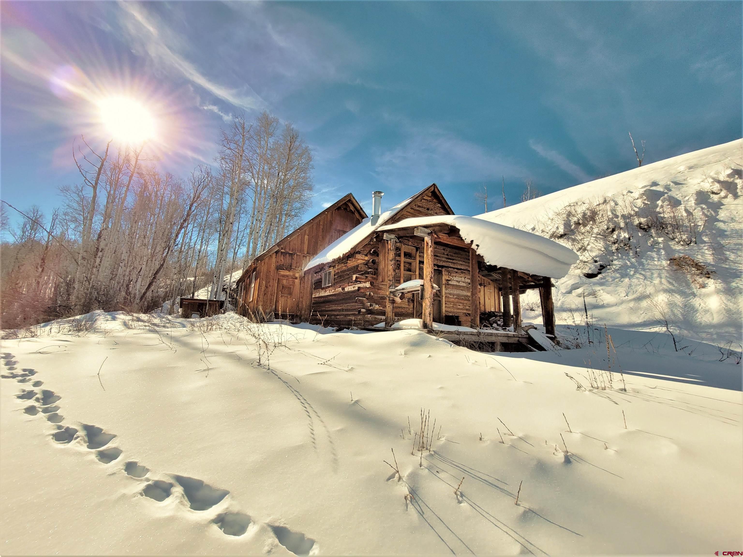 a view of a house with snow on the ground