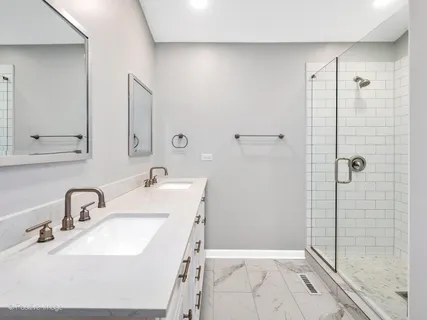 a bathroom with a sink and shower