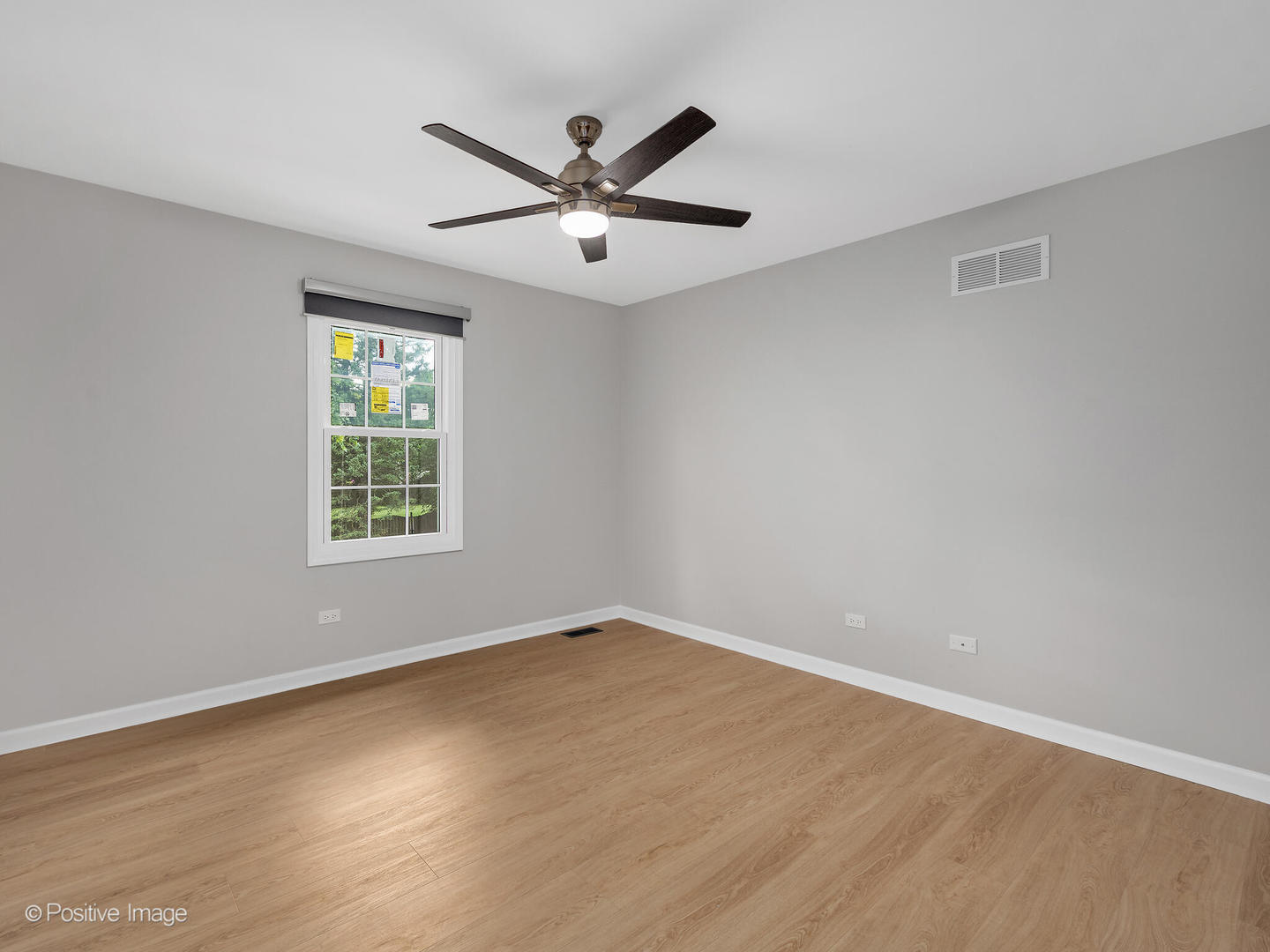 805 Potomac Avenue Naperville, IL 60565 - Photo 23 of 38 an empty room with wooden floor fan and windows