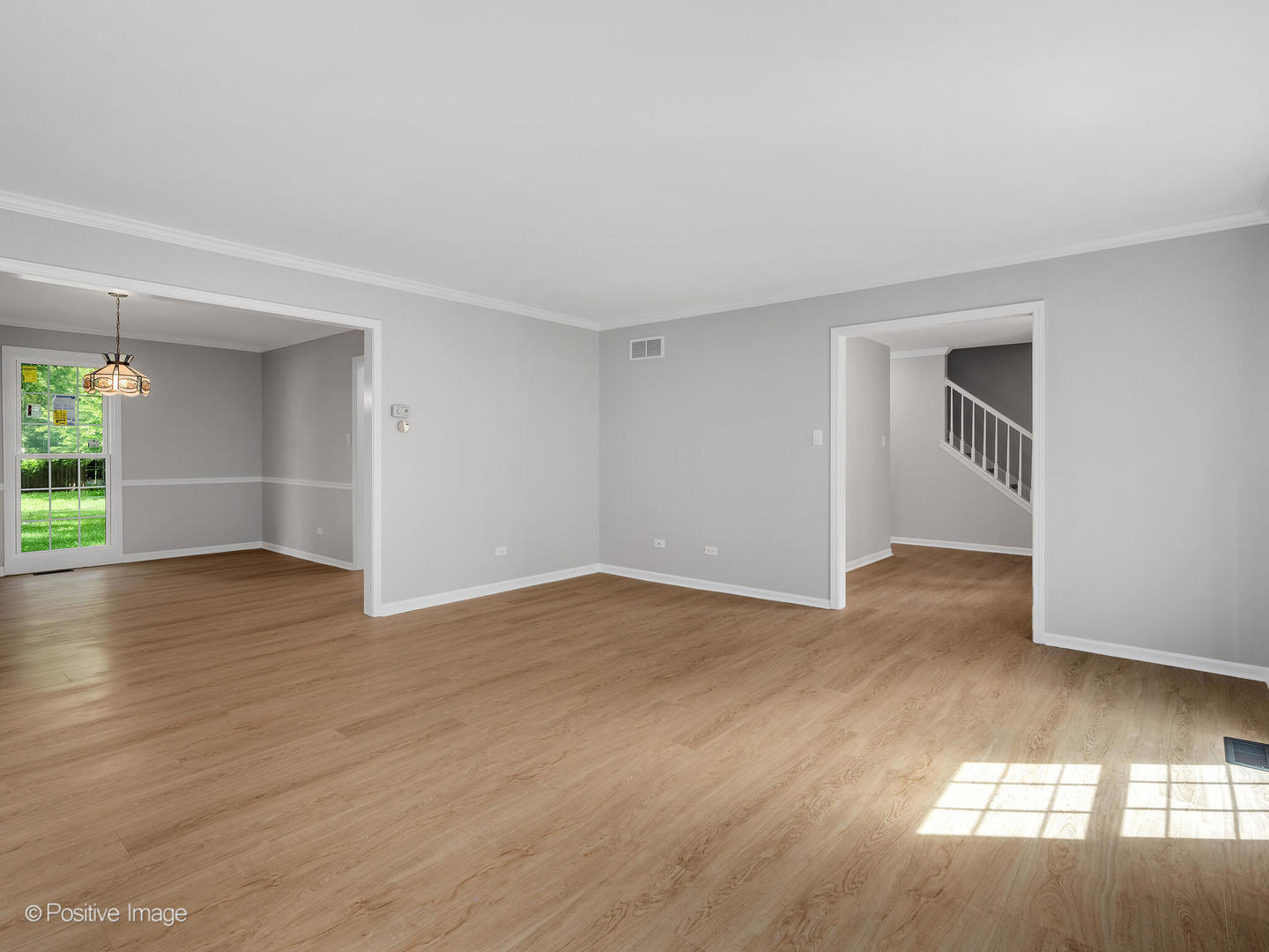 805 Potomac Avenue Naperville, IL 60565 - Photo 4 of 38 a view of empty room with wooden floor and fan