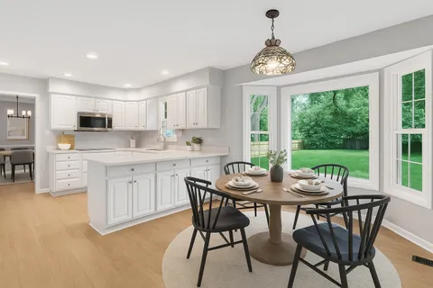 a view of a dining room with furniture window and outside view