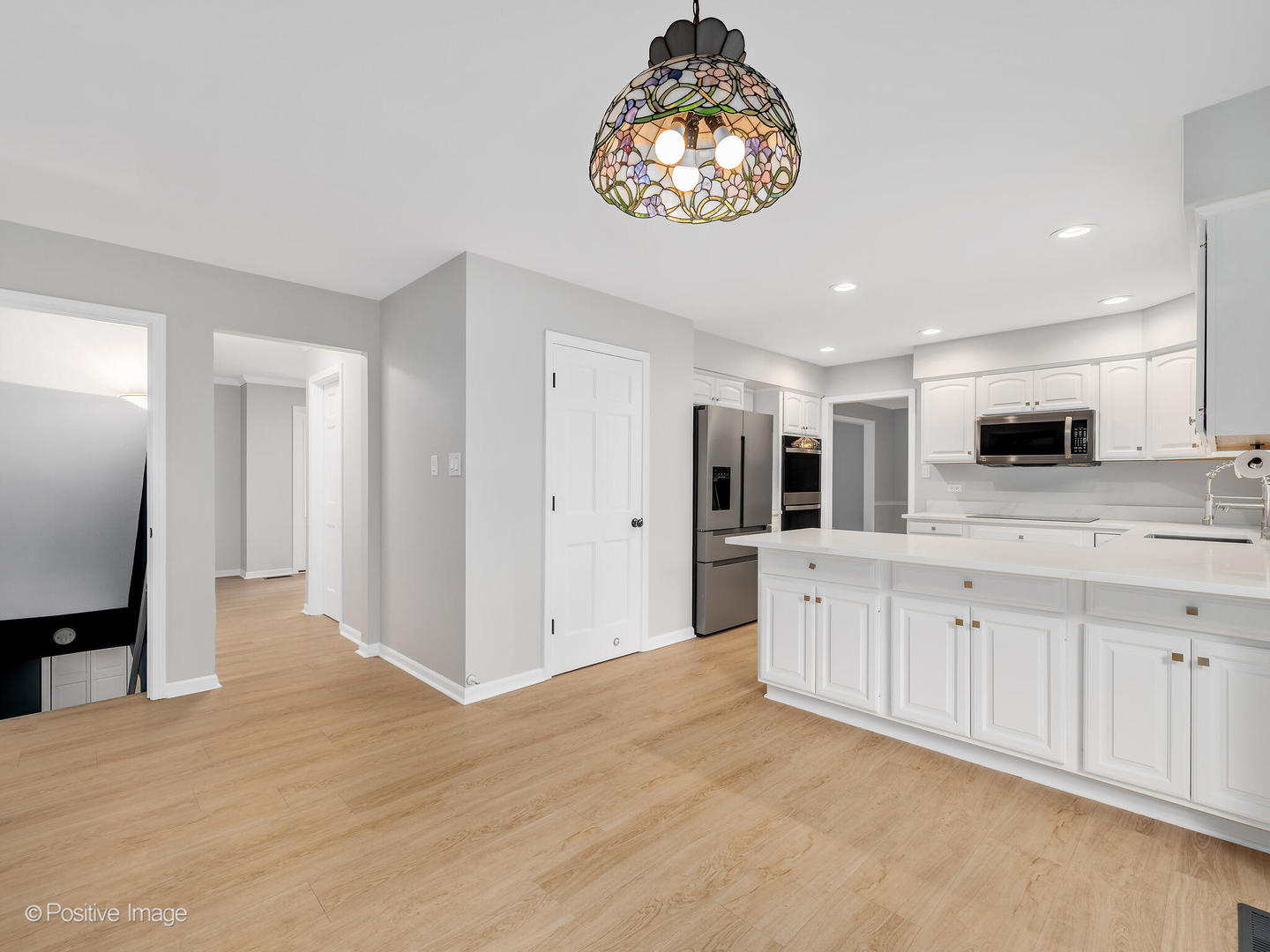805 Potomac Avenue Naperville, IL 60565 - Photo 10 of 38 a large white kitchen with a dishwasher and a large refrigerator