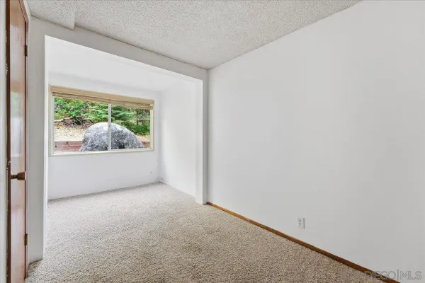 a view of a room with a hallway