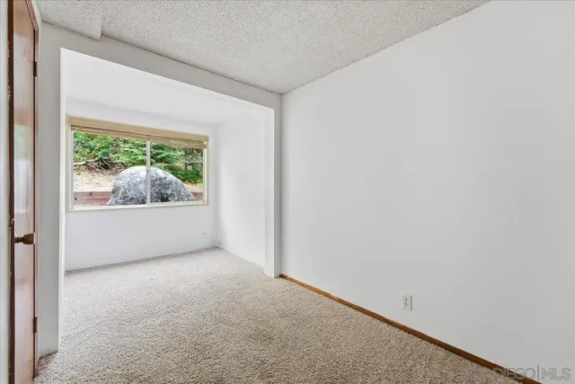 a view of a room with a hallway