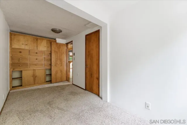 a view of empty room with windows