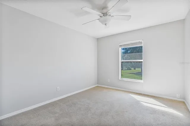 a bathroom with a granite countertop sink toilet a mirror and shower