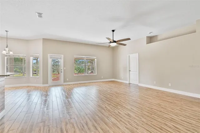 a view hallway with hallway and wooden floor