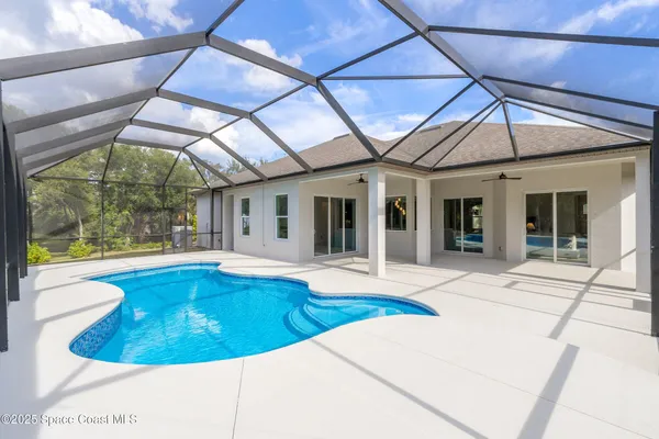 a view of a house with swimming pool