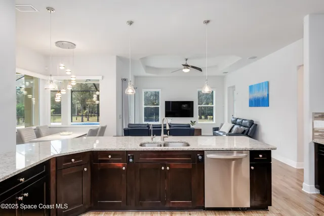 a large living room with furniture and a large window